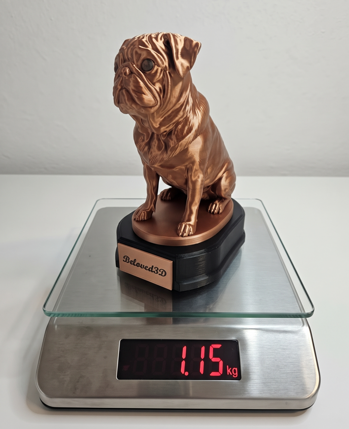 Pug memorial statuette on a scale showing a weight of 1.15 kilograms