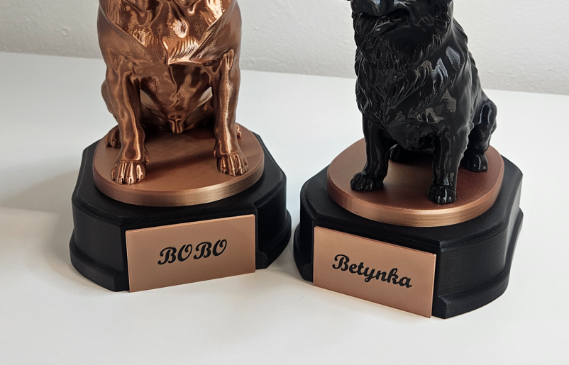 Personalized BOBO and Betynka labels on the bases of two pet statuettes